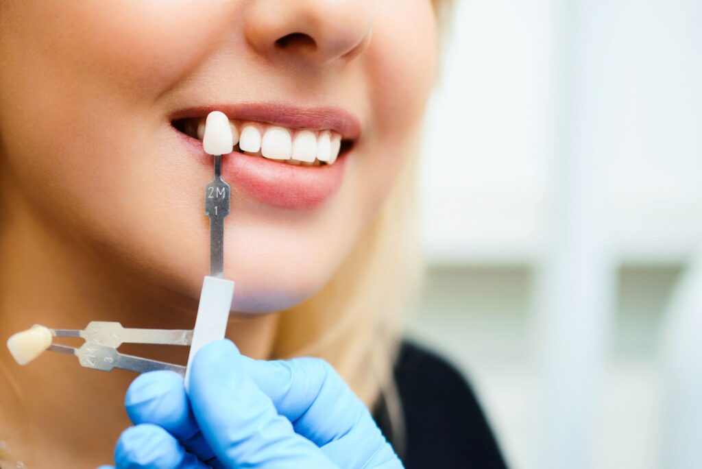 woman getting a porcelain veneer consultation in Plano Texas